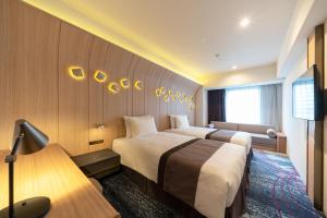 เตียงในห้องที่ Hotel JAL City Nagoya Nishiki