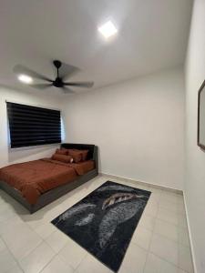 a bedroom with a bed and a ceiling fan at Residensi Afamosa in Kampong Alor Gajah