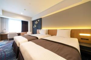 เตียงในห้องที่ Hotel JAL City Nagoya Nishiki