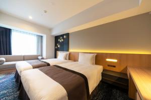 เตียงในห้องที่ Hotel JAL City Nagoya Nishiki