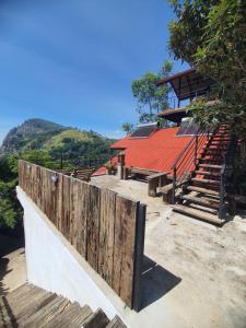 a building with stairs and a red roof at Ella Mount View Guest Inn in Ella
