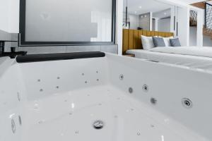 Ένα ή περισσότερα κρεβάτια σε δωμάτιο στο Hotel Andante Rust