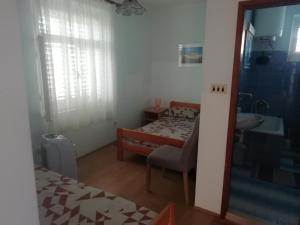 Postel nebo postele na pokoji v ubytování Apartmani Kolenić