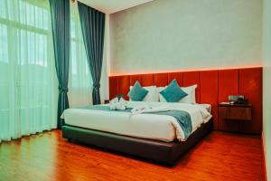 Sangkahak Mith Hotel客房内的一张或多张床位