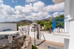 a view from the balcony of a building with mountains in the background at Kefos Apartments Paros in Kóstos