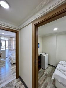 Postel nebo postele na pokoji v ubytování EYFEL HOTEL
