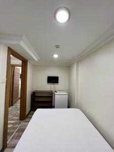 Postel nebo postele na pokoji v ubytování EYFEL HOTEL