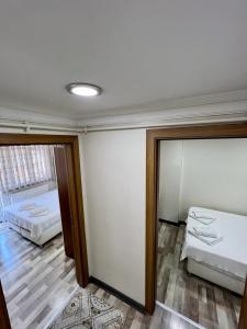 Postel nebo postele na pokoji v ubytování EYFEL HOTEL
