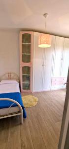 Ένα ή περισσότερα κρεβάτια σε δωμάτιο στο Nenni - Casa Vacanze