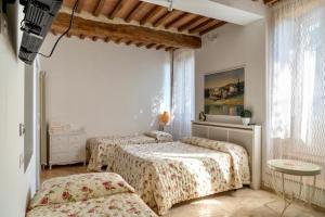 A bed or beds in a room at Agriturismo Percenna