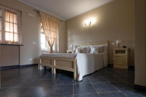 Postel nebo postele na pokoji v ubytování Albergo la Luna