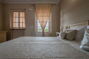 Postel nebo postele na pokoji v ubytování Albergo la Luna