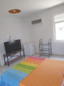 Säng eller sängar i ett rum på Beldibi Apart Homes
