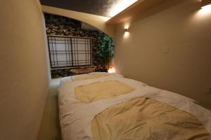 Krevet ili kreveti u jedinici u okviru objekta お宿 櫻川　Oyado Sakuragawa