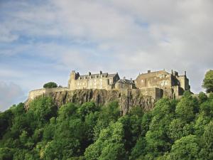 a castle perched on top of a mountain at Castle Brae Apartment in Stirling