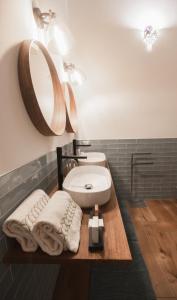 a bathroom with a sink and a mirror at Villa Platani Luxury Suite in Cianciana