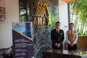 Členové personálu v ubytování AMATA Residence