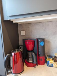two coffee makers sitting on a kitchen counter at cosy 2 bedroom apartment 75m2 in Mönchengladbach