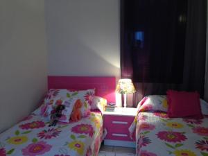 מיטה או מיטות בחדר ב-Casa Playa Macenas