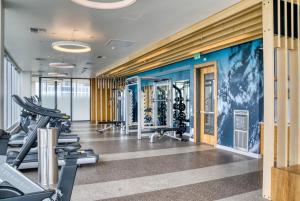a gym with cardio equipment in a building at Downtown 2br w Gym wd BBQ nr dining shops SEA-402 in Seattle