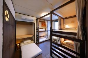 Postel nebo postele na pokoji v ubytování Sendai Guest House UMEBACHI