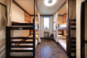 Postel nebo postele na pokoji v ubytování Sendai Guest House UMEBACHI