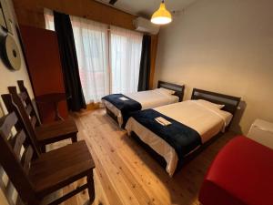 Postel nebo postele na pokoji v ubytování NAAARU