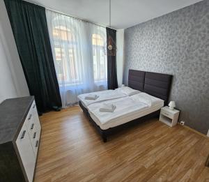 Postel nebo postele na pokoji v ubytování Penzión TIME