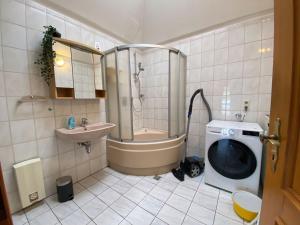 a bathroom with a shower and a toilet and a sink at Cozy Apartment in Oberhausen in Oberhausen