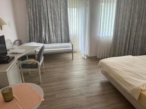 Letto o letti in una camera di Hotel Garni Classico