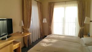 מיטה או מיטות בחדר ב-Hotel Fernsicht