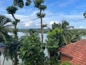 a view of the river from a house at The Raviz Kadavu, Kozhikode in Kozhikode