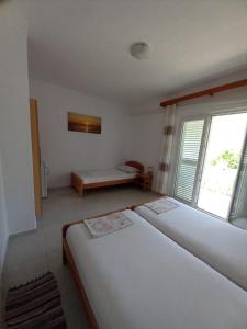 Postel nebo postele na pokoji v ubytování Accommodation Drasko