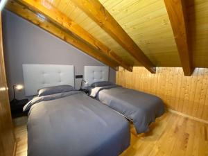 Postel nebo postele na pokoji v ubytování Ático Dúplex En Valle De Incles - Parking Gratis l by BonesVacances