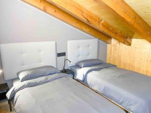 Postel nebo postele na pokoji v ubytování Ático Dúplex En Valle De Incles - Parking Gratis l by BonesVacances