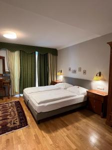 Postel nebo postele na pokoji v ubytování Hotel Gösser Bräu