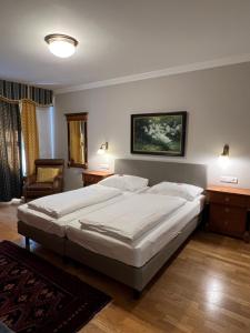 Ein Bett oder Betten in einem Zimmer der Unterkunft Hotel Gösser Bräu