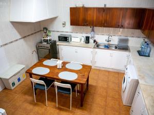Кухня или мини-кухня в Casa D'Olívia
