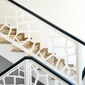 a glass stair case with a geometric pattern on it at Casa Micle - Free Private Parking in Craiova