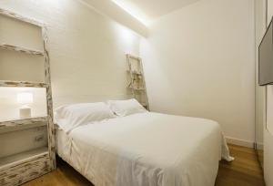 Posteľ alebo postele v izbe v ubytovaní Ferrini Home - Suites