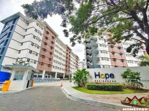 a row of apartment buildings in a city at J & F Homestay - Cavite, Philippines in Trece Martires