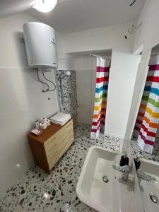 a bathroom with a sink and a mirror at Ada in Zadar