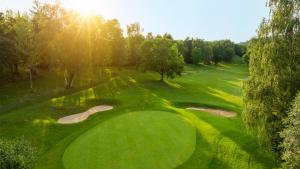 an overhead view of a golf green with two putts at Golf Domaine Du Val De Sorne in Vernantois