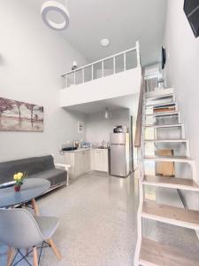 a living room with a loft bed and a kitchen at FLORIDA HOTEL, ADULTS only in Rhodes Town