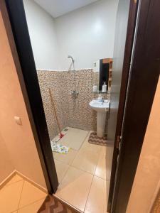 a bathroom with a shower and a sink at شقة بمراكش in Marrakesh
