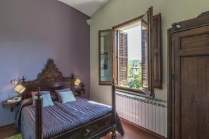 Postel nebo postele na pokoji v ubytování Hotel Monumento Can Garay