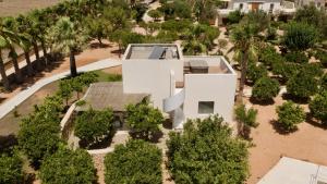an aerial view of a white house with trees at Can Jaume Private Villas by Ocean Drive in Ibiza Town