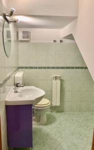 a bathroom with a toilet and a sink at Edera in Porto Corsini