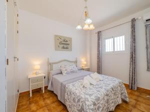 a bedroom with a bed with a teddy bear on it at Cubo's El Sueño de los Abuelos Privacy Pool in Alhaurín el Grande +52 photos