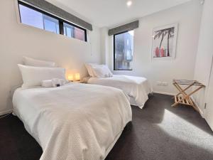 Llit o llits en una habitació de Modern & Central City - By KOSH BNB